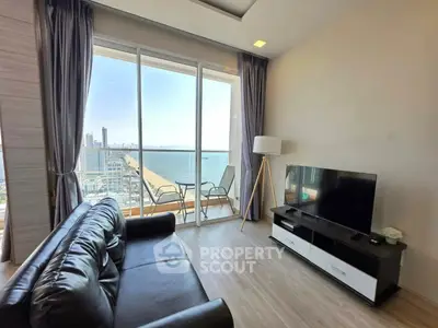 Modern living room with stunning ocean view and balcony access