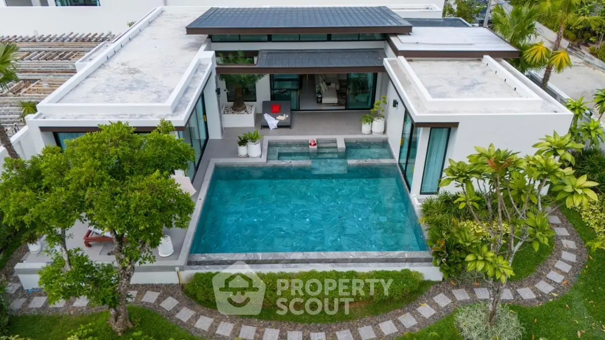 Luxurious modern villa with private pool and lush garden