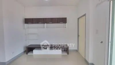 Modern minimalist interior with sleek storage solutions and neutral tones.