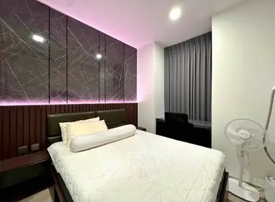 Modern bedroom with stylish lighting and elegant decor