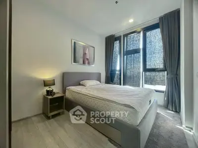 Modern bedroom with large windows and stylish decor