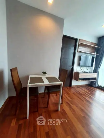 Modern living room with wooden flooring and stylish furniture