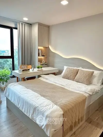 Modern bedroom with stylish decor and natural light