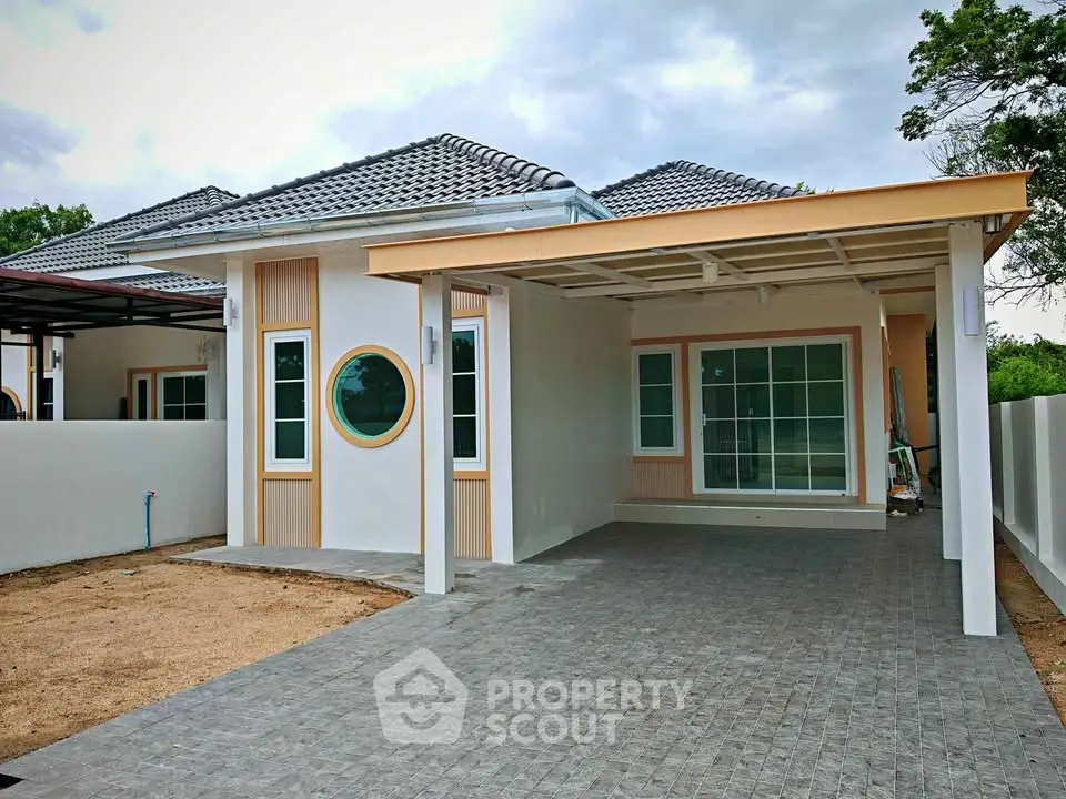 Charming single-story home with modern design and spacious driveway