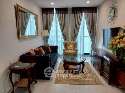 Elegant living room with classic furniture and large windows, perfect for relaxation and entertainment.