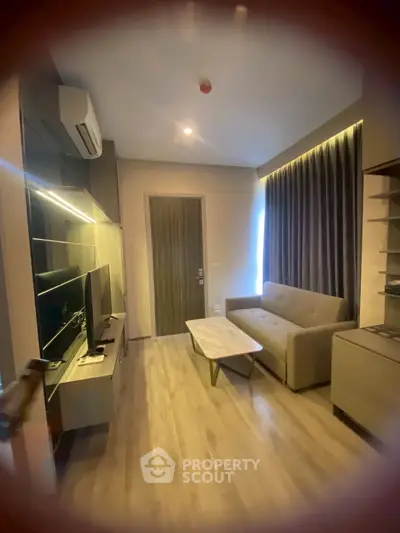 Modern living room with sleek furniture and ambient lighting, perfect for cozy evenings.