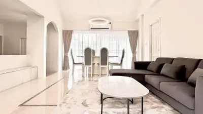 Spacious modern living room with elegant dining area and stylish furniture.