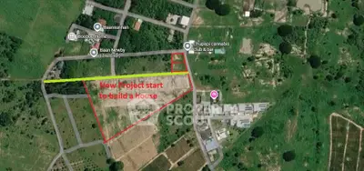 Aerial view of new real estate project site with marked boundaries and nearby amenities.