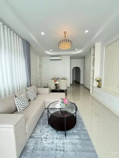 Elegant living room with modern decor and chandelier lighting