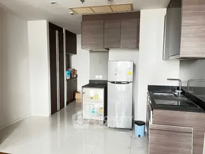 Modern kitchen with sleek cabinetry and stainless steel appliances