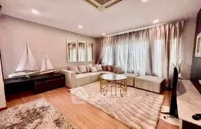 Luxurious living room with elegant decor and ample natural light