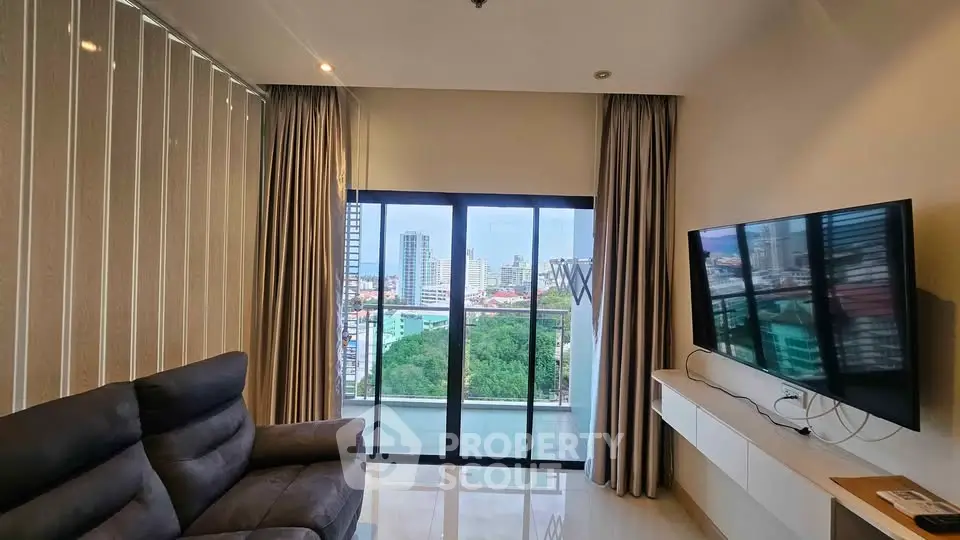 Modern living room with city view, sleek furniture, and large windows in a high-rise apartment.