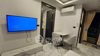 Modern apartment interior with wall-mounted TV and air conditioning