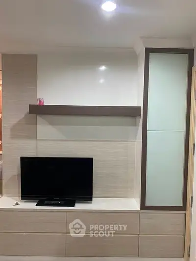 Modern living room with sleek TV unit and minimalist design