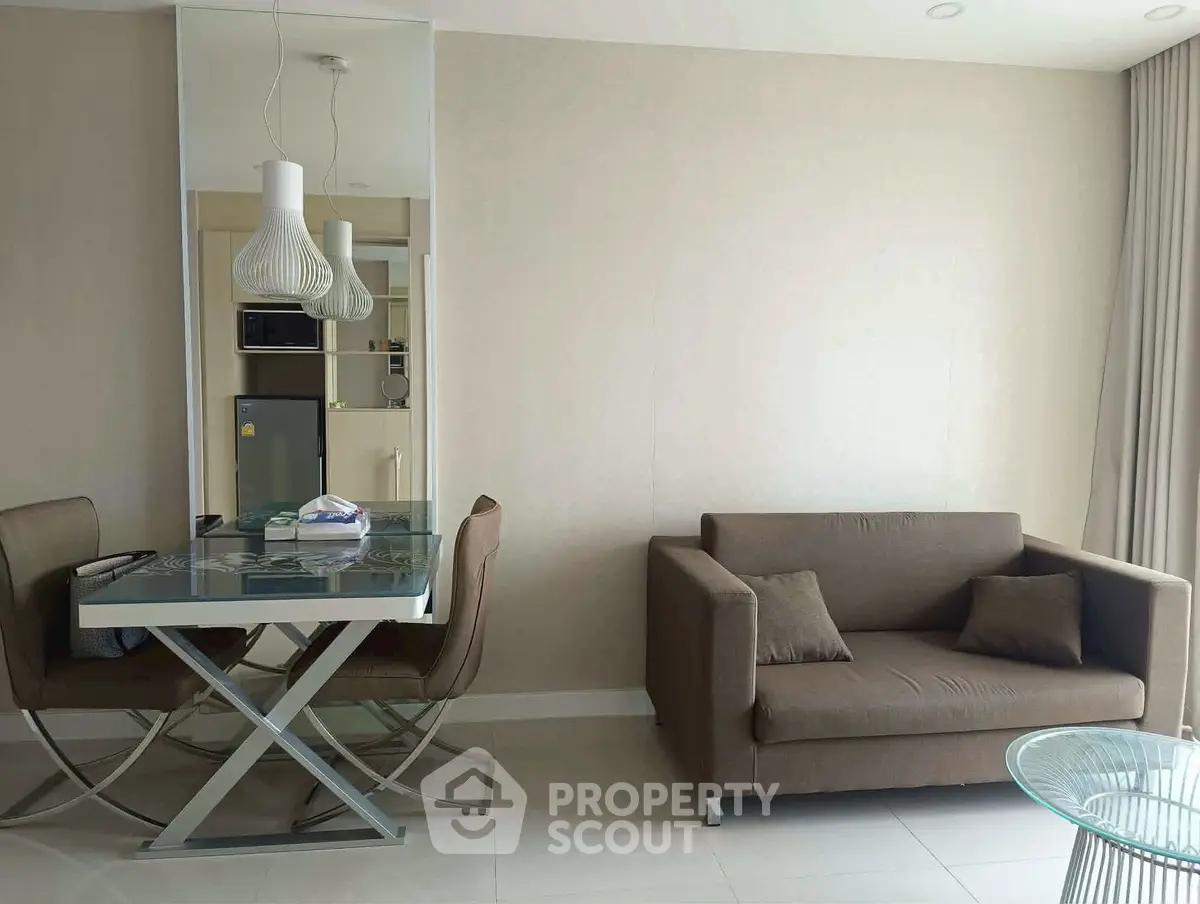 Modern living room with stylish dining area and cozy sofa, perfect for urban living.