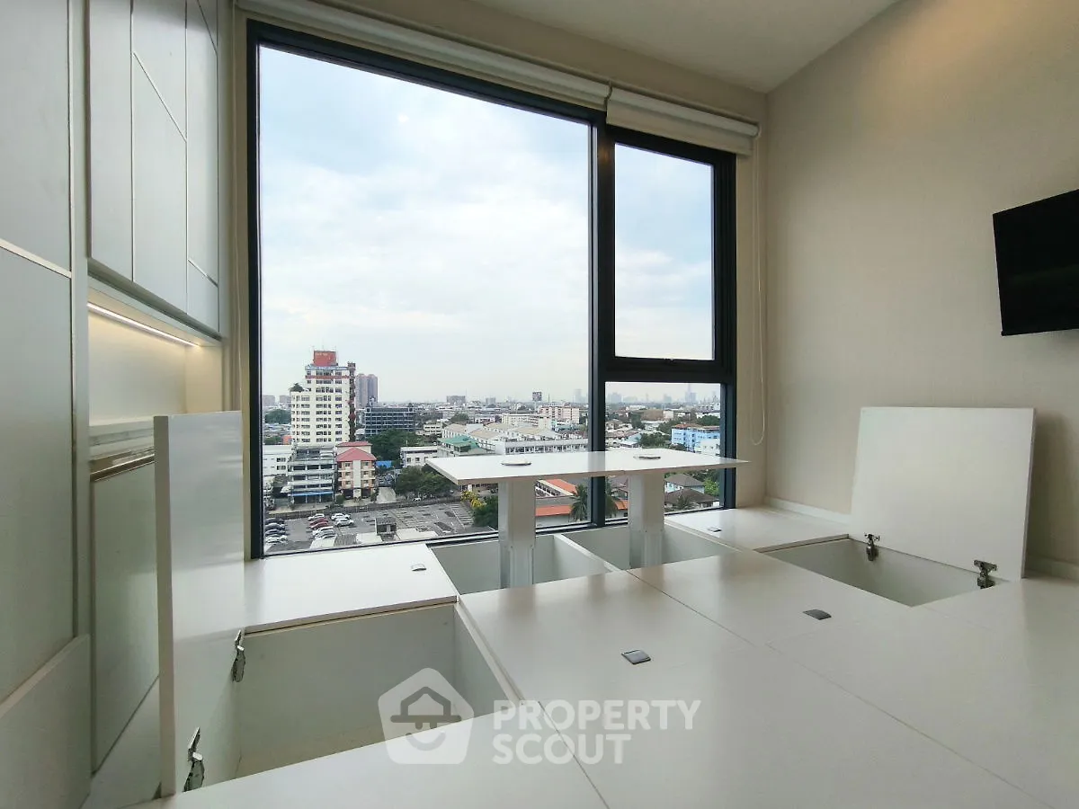 Modern apartment with innovative storage solutions and panoramic city view.