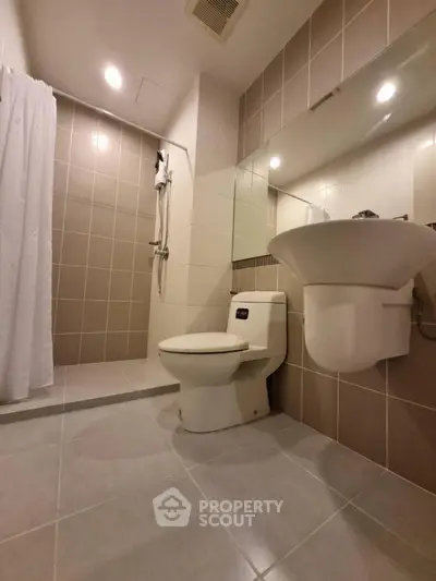 Modern bathroom with sleek design and spacious shower area