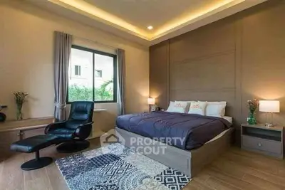 Luxurious bedroom with modern decor and cozy ambiance