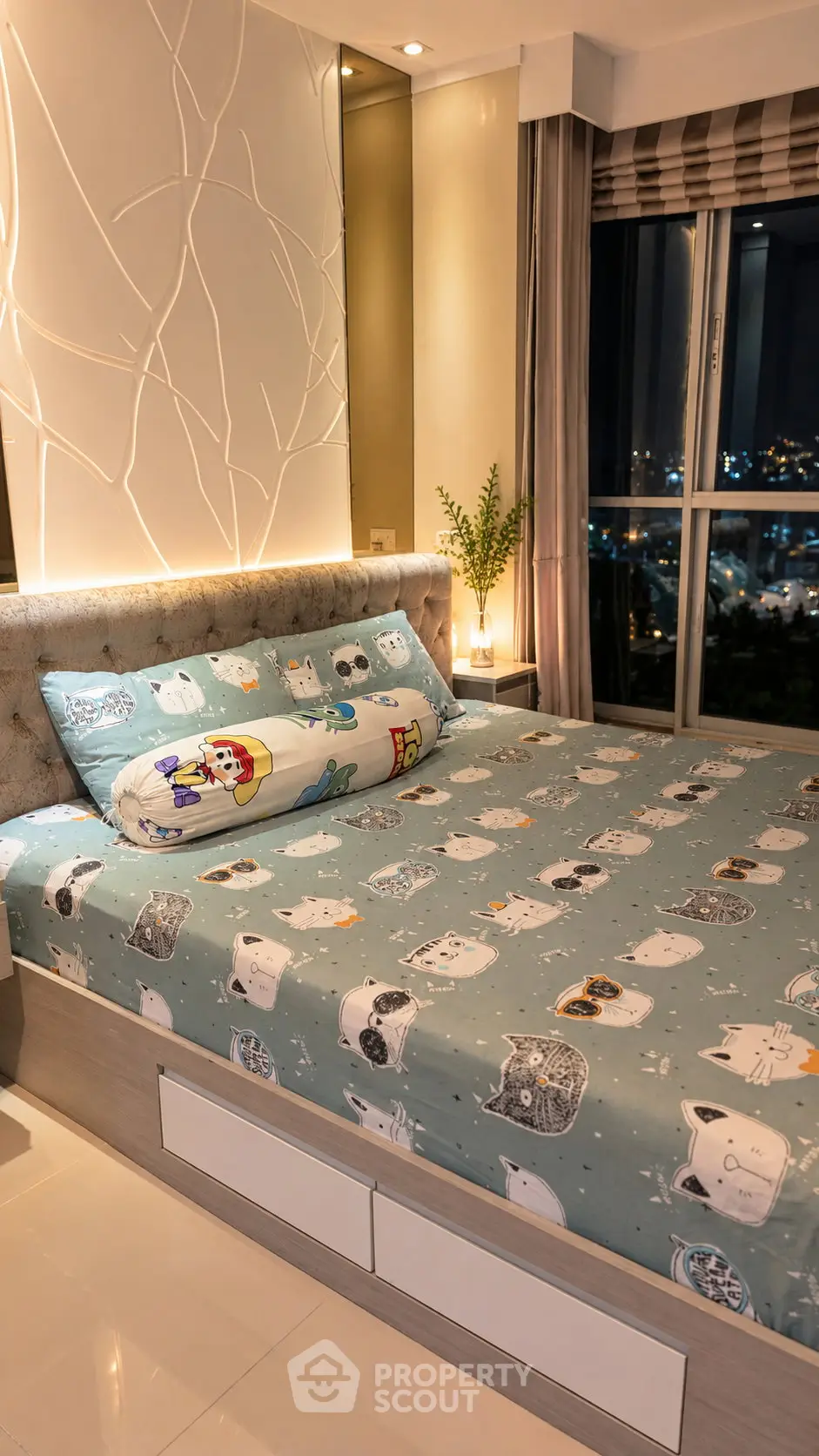 Cozy bedroom with stylish decor and city view, featuring a plush bed and elegant lighting.