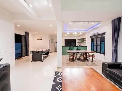 Spacious open-plan living area with modern kitchen and dining space