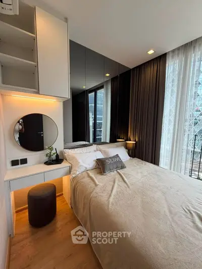Modern bedroom with stylish decor and floor-to-ceiling windows in a high-rise apartment.