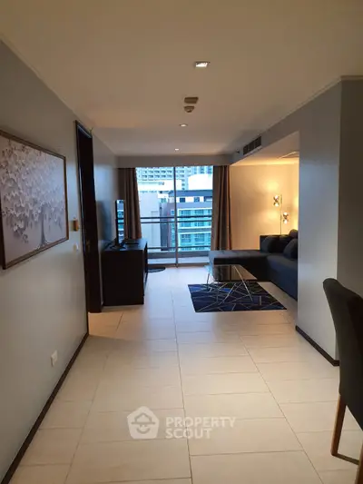 Spacious modern living room with balcony view in urban apartment