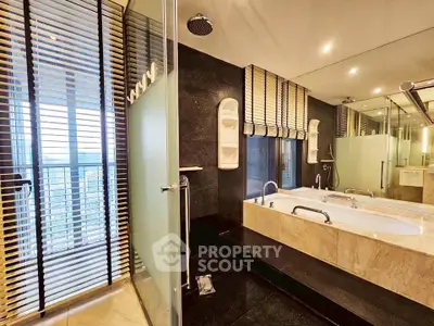 Luxurious modern bathroom with large bathtub and glass shower enclosure