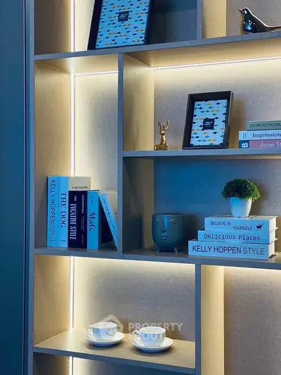 Stylish modern shelving unit with decorative items and books in a contemporary living space.
