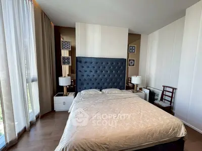 Luxurious bedroom with elegant decor and large windows for natural light