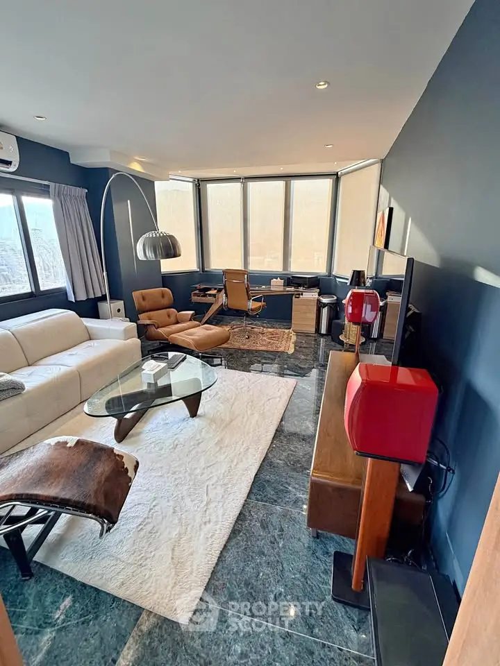 Luxurious living room with modern decor and panoramic windows