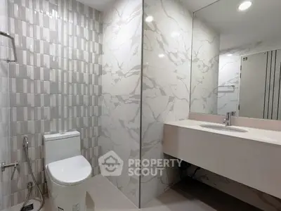 Modern bathroom with elegant marble tiles and sleek fixtures