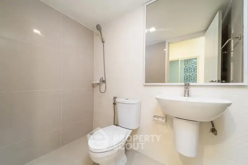 Modern bathroom with sleek fixtures and minimalist design.