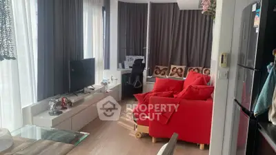 Stylish living room with red sofa and modern decor in a bright apartment