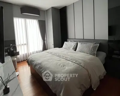 Luxurious bedroom with modern design and ample natural light
