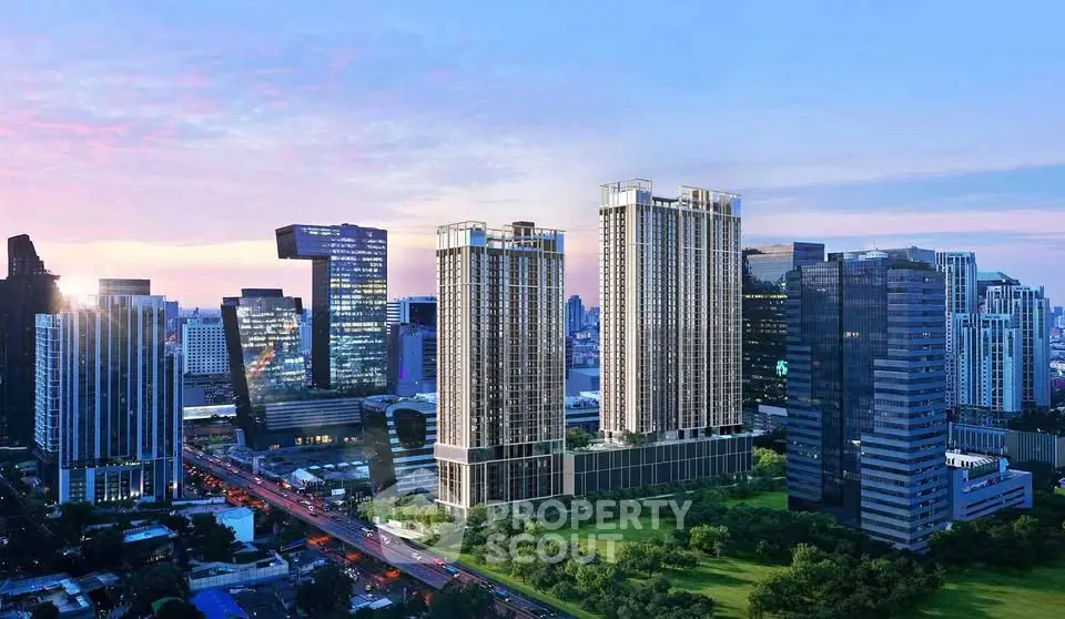 Stunning cityscape view with modern high-rise buildings and lush green surroundings at sunset.