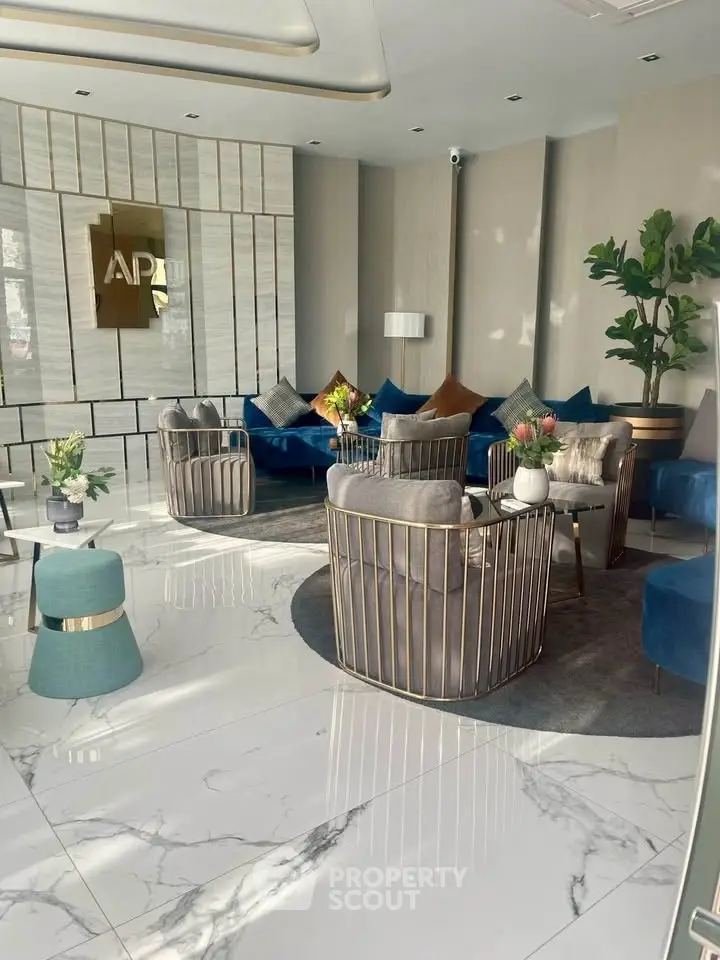 Luxurious modern lobby with elegant seating and marble flooring in a high-end building.