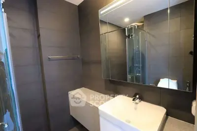 Modern bathroom with sleek design and large mirror