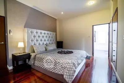 Luxurious bedroom with elegant decor and polished wooden floors