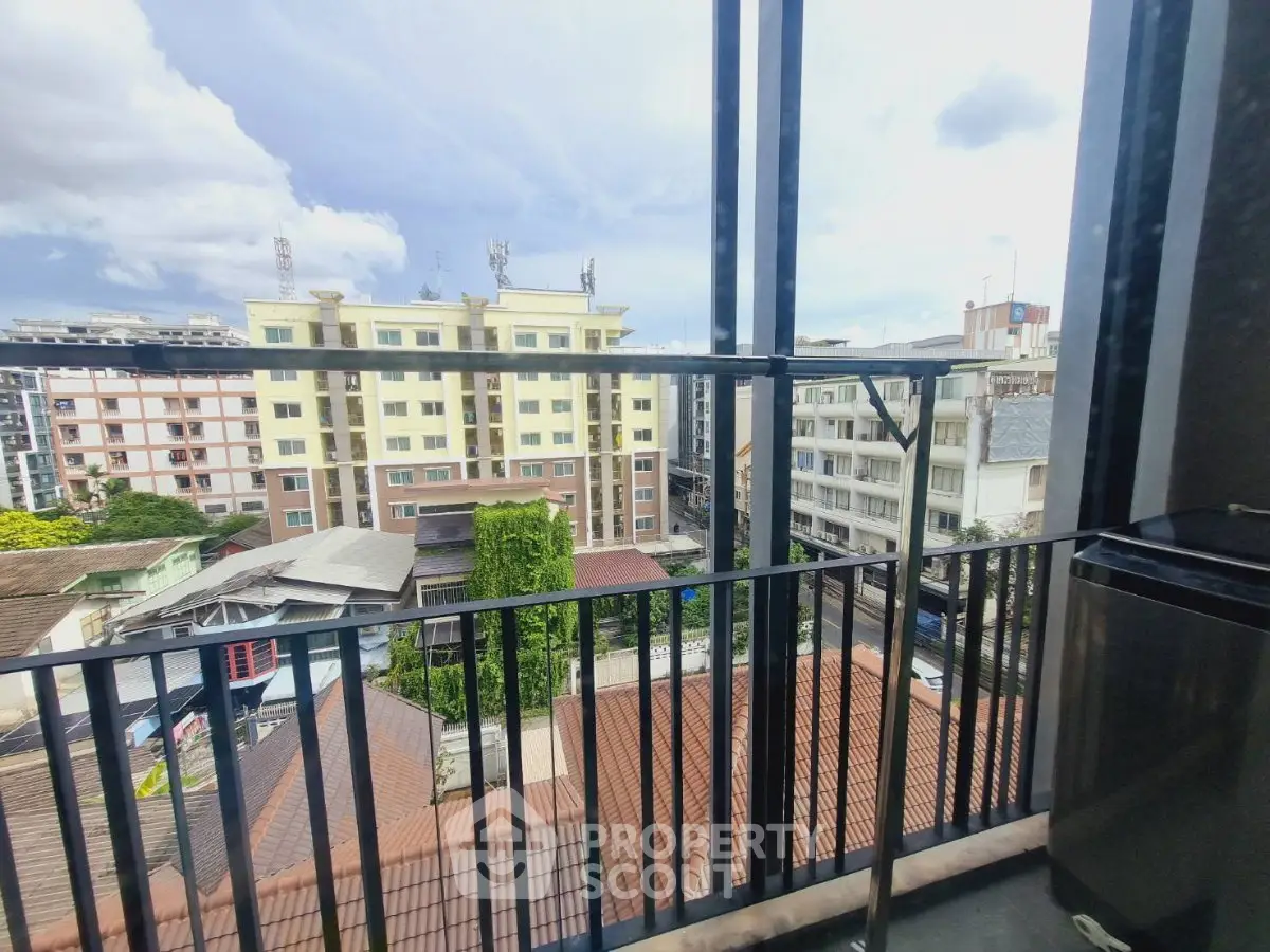 Stunning city view from a modern balcony in a high-rise apartment, perfect for urban living.