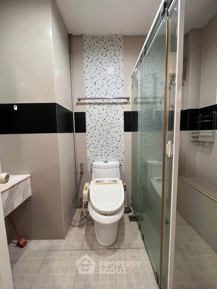 Modern bathroom with sleek design and glass shower enclosure