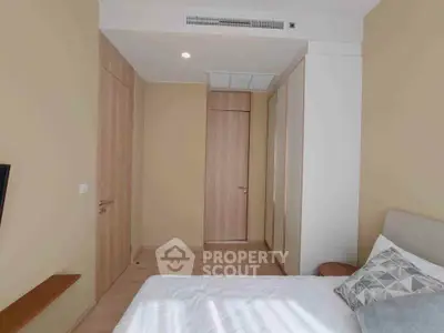 Cozy bedroom with modern design and ample natural light