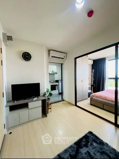 Modern apartment interior with open layout, featuring a cozy living area and stylish bedroom.