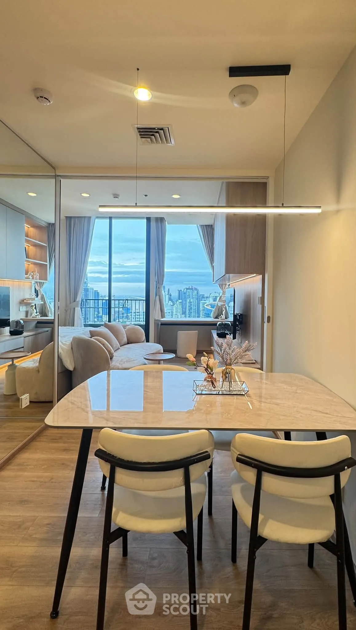 Modern dining area with city view in luxury apartment