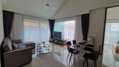 Spacious modern living room with elegant decor and pool view