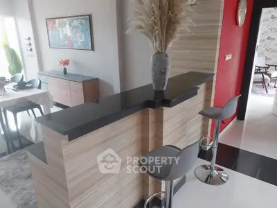 Modern interior with stylish bar counter and chic decor in open living space