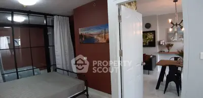 Modern apartment interior with stylish dining area and cozy bedroom, featuring contemporary decor and open layout.