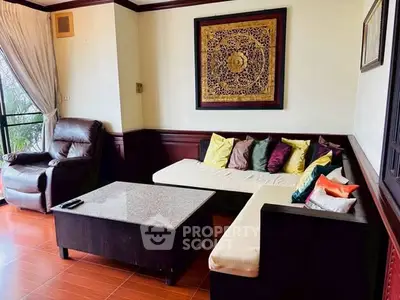 Charming living room with cozy sectional sofa and elegant decor, perfect for relaxation and entertaining.