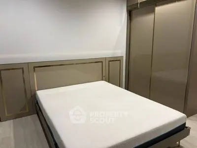Modern bedroom with sleek wardrobe and minimalist design, perfect for urban living.
