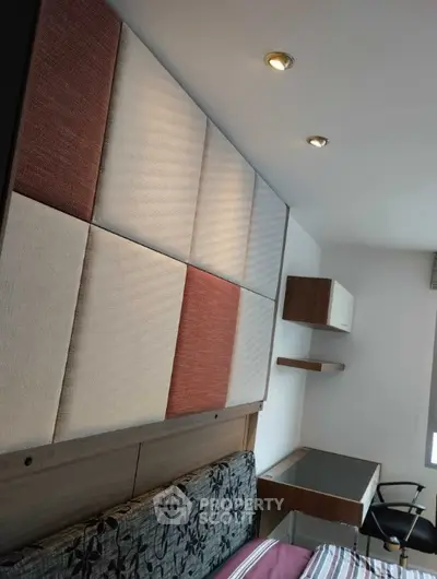 Modern bedroom with stylish wall panels and sleek desk