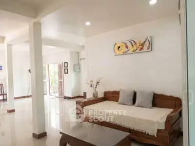 Spacious living room with elegant wooden furniture and modern decor